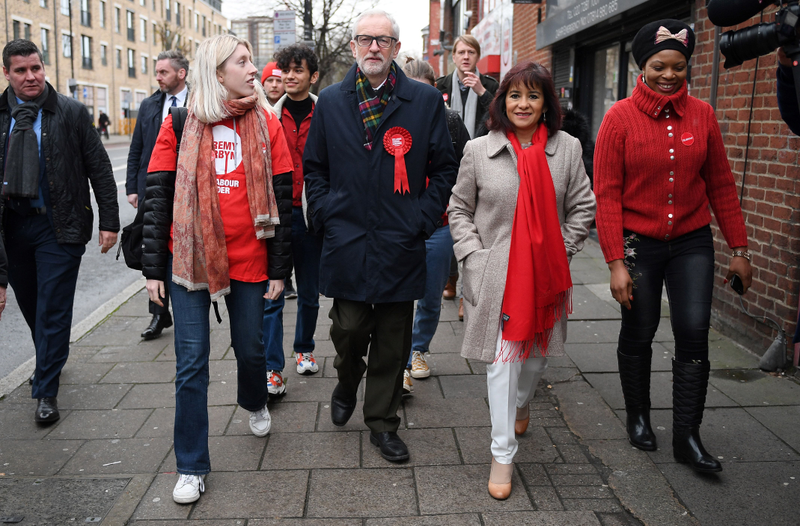 Britain’s main opposition Labour Party leader Jeremy Corbyn walks to a Polling Station to cast his ballot paper and vote, in north London on December 12, 2019, as Britain holds a general election.